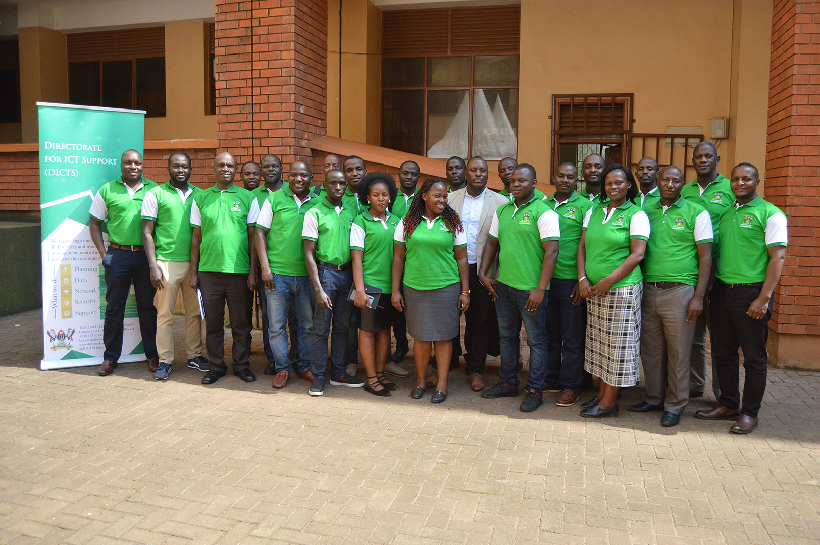 The Director DICTS, Mr. Samuel Paul Mugabi (Centre in coat) poses for a group photo with members of his team after the Workshop on Social Media as an enabler of effective communication, eLearning and cyber-crime prevention on 13th February 2020, CEDAT, Makerere University, Kampala Uganda.